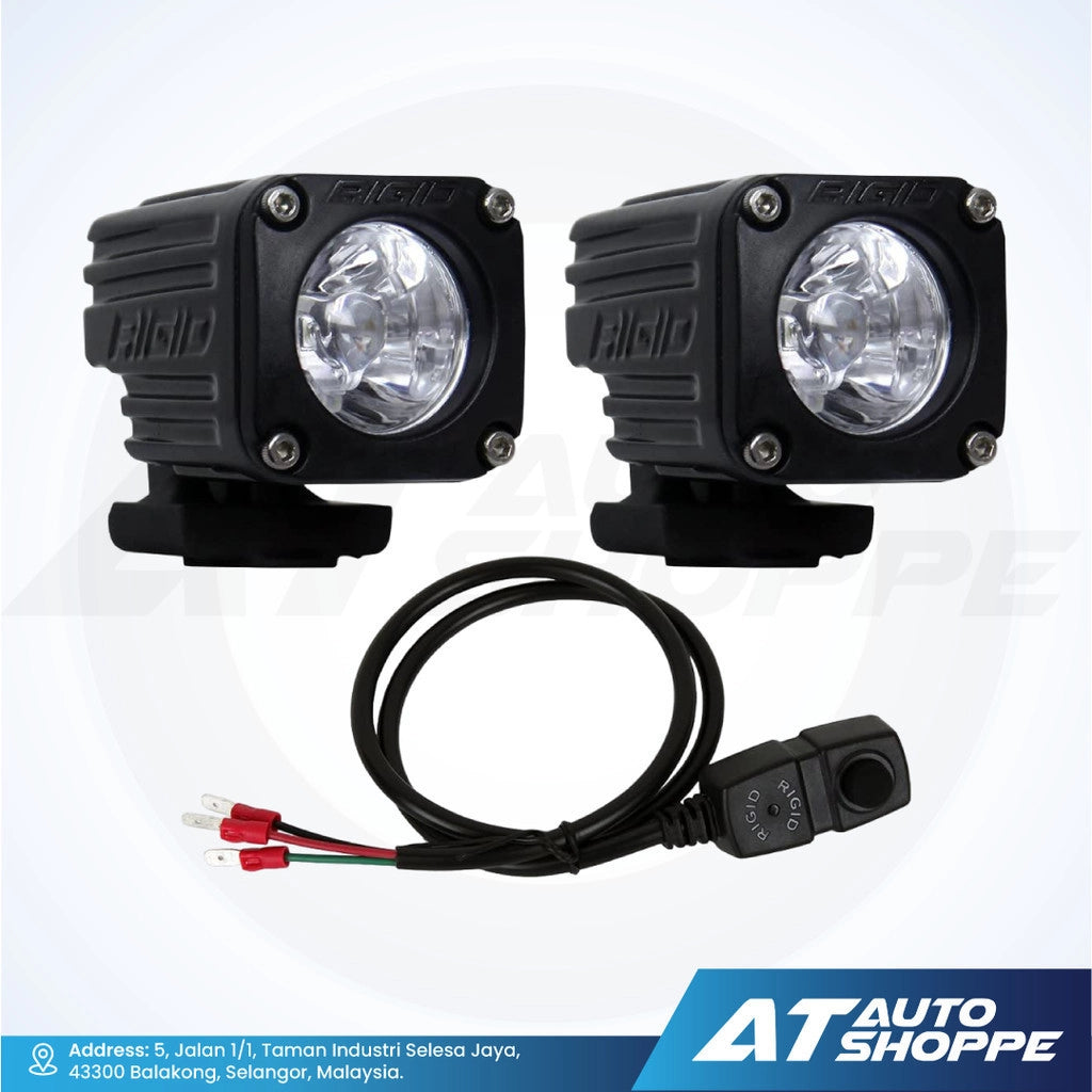 Two off-road Rigid lights with wiring harness on a white background, featuring the AT Auto Shoppe logo.
