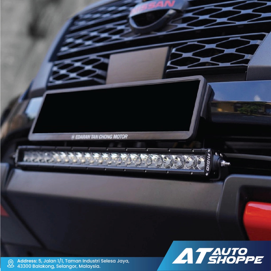 Car grille with a Rigid LED light bar and 'AT Auto Shoppe' branding.