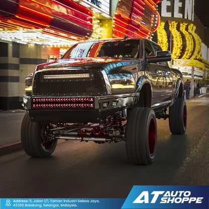 Black modified truck on a street with Rigid lights with neon signs in the background, featuring AT Auto Shoppe branding.