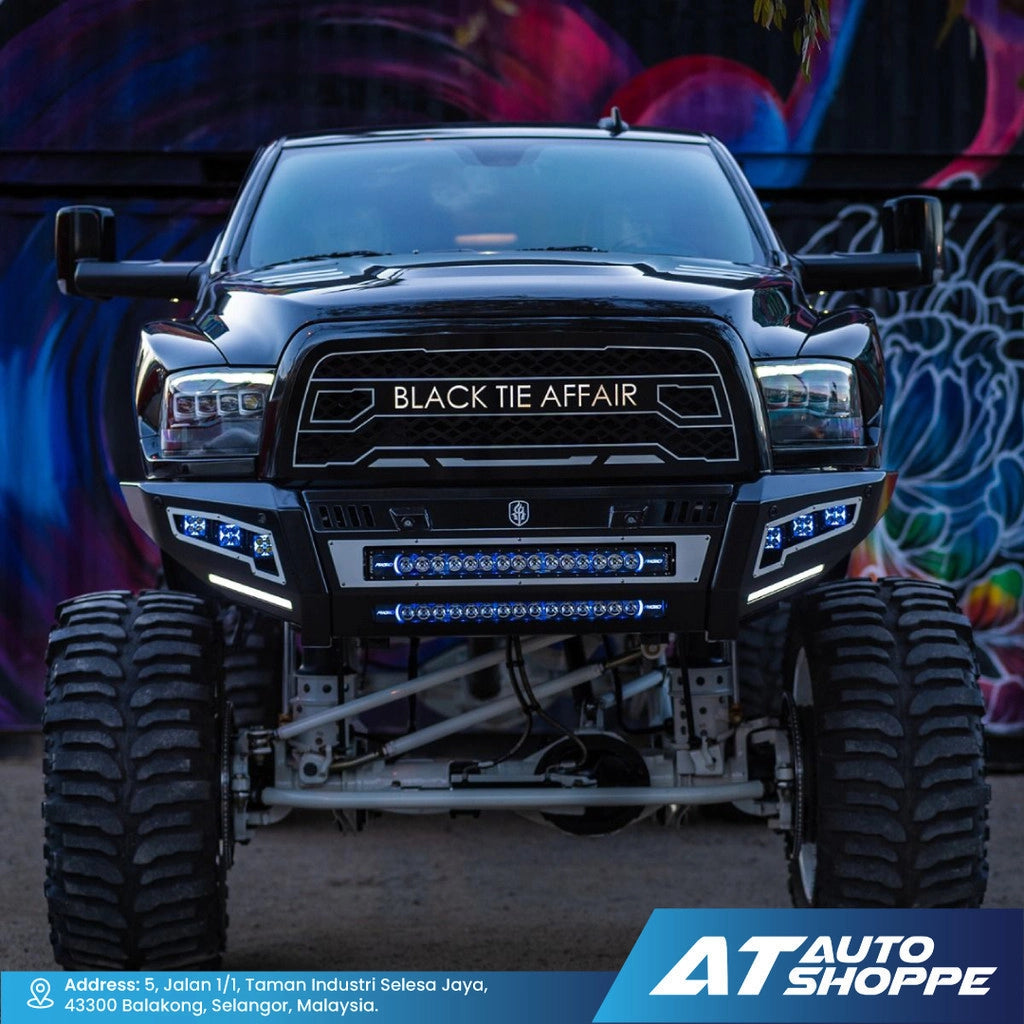 Black off-road vehicle with Right light bar in front of a colorful mural.