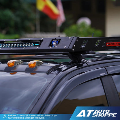 Rigid light bar on a vehicle with 'AT Auto Shoppe' branding.