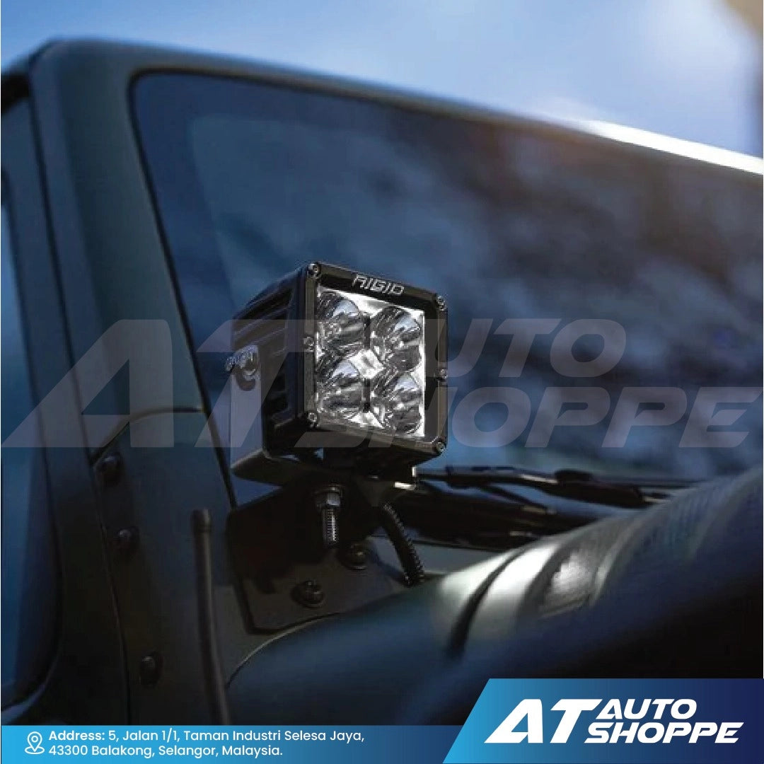 Rigid car fog light mounted on a vehicle with AT Auto Shoppe branding.