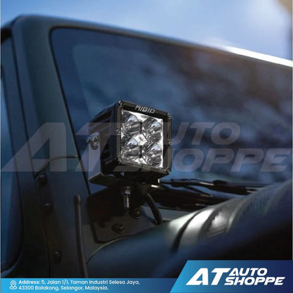 Rigid car fog light mounted on a vehicle with AT Auto Shoppe branding.