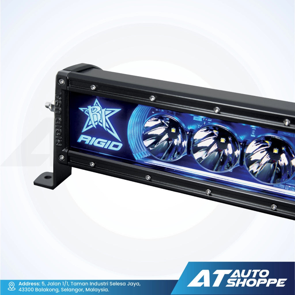 Rigid Industries light bar with blue accents on a white background, featuring AT Auto Shoppe branding.