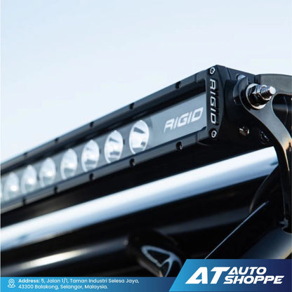 Rigid Industries light bar on a vehicle with AT Auto Shoppe branding.