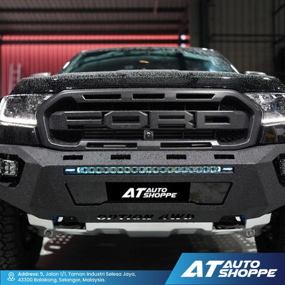 Front view of a Ford truck with AT Auto Shoppe branding