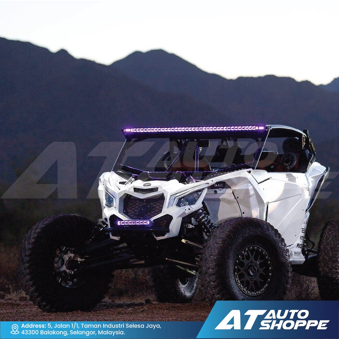 Off-road vehicle with a mountainous background and AT Auto Shoppe branding.