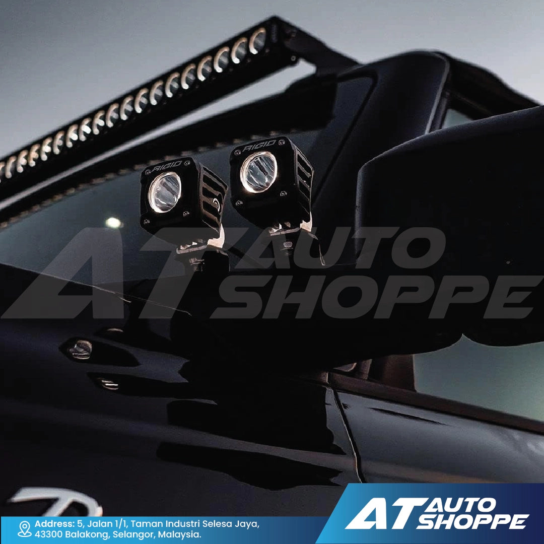 Rigid Industries car lights mounted on a vehicle with AT Auto Shoppe branding.