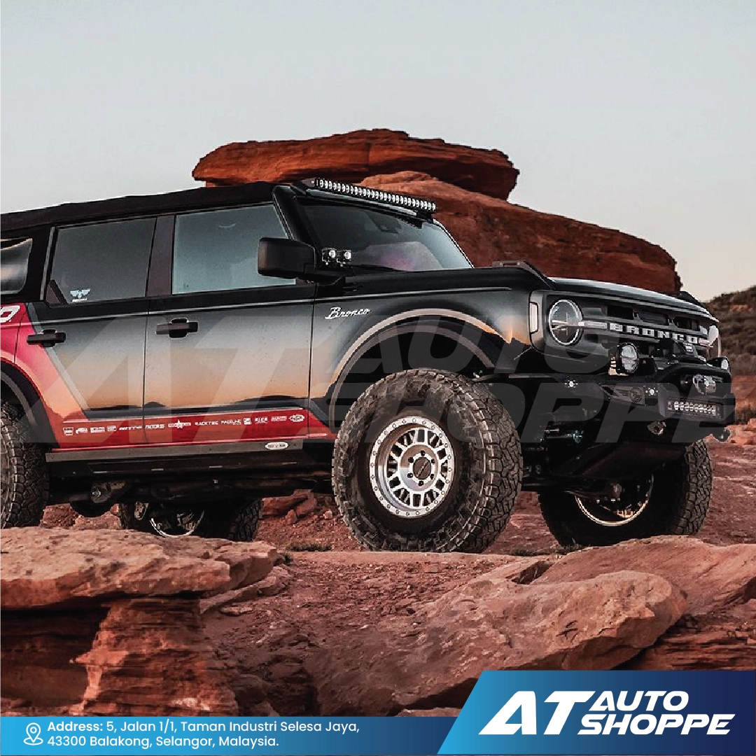 Off-road vehicle with Rigid Revolve Pods on rocky terrain with AT Auto Shoppe branding
