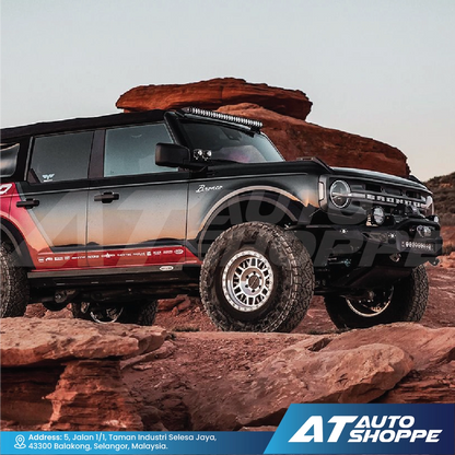 Off-road vehicle with Rigid Revolve Pods on rocky terrain with AT Auto Shoppe branding