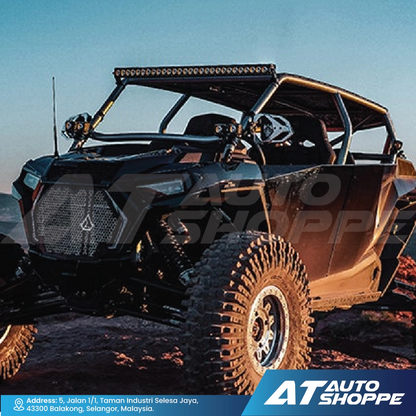Off-road vehicle with Rigid Pods on a rocky terrain with AT Auto Shoppe branding