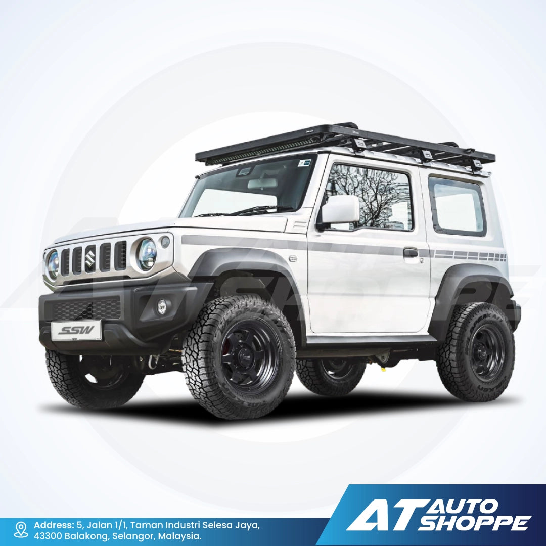 White SUV with roof rack on a white background, featuring AT Auto Shoppe branding.