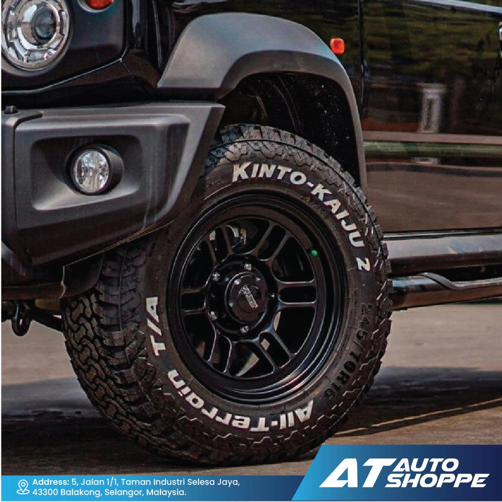 Close-up of a black tire with 'SSW' branding on a vehicle, featuring 'AT Auto Shoppe' logo.