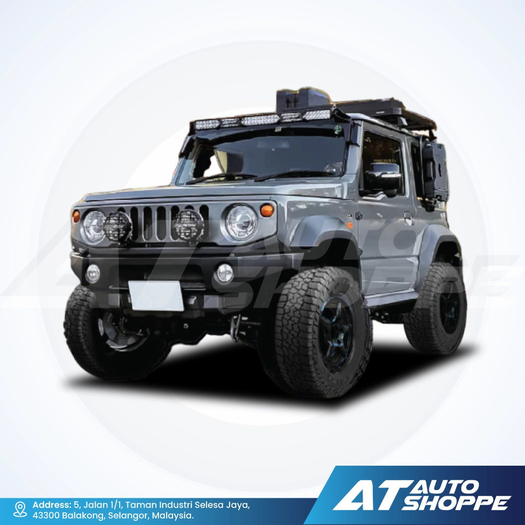 Gray off-road vehicle on a white background with AT Auto Shoppe branding.