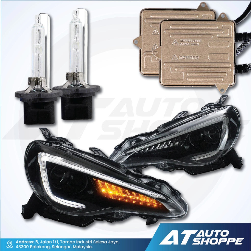 Automotive parts including headlights, bulbs, and connectors on a white background with AT Auto Shoppe branding.