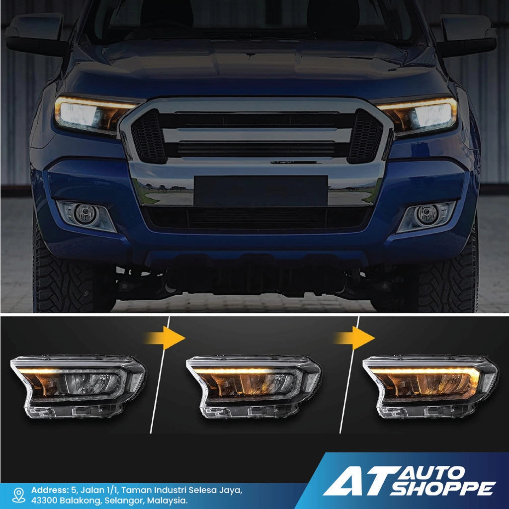 Blue truck with view of Vland headlights and AT Auto Shoppe branding.