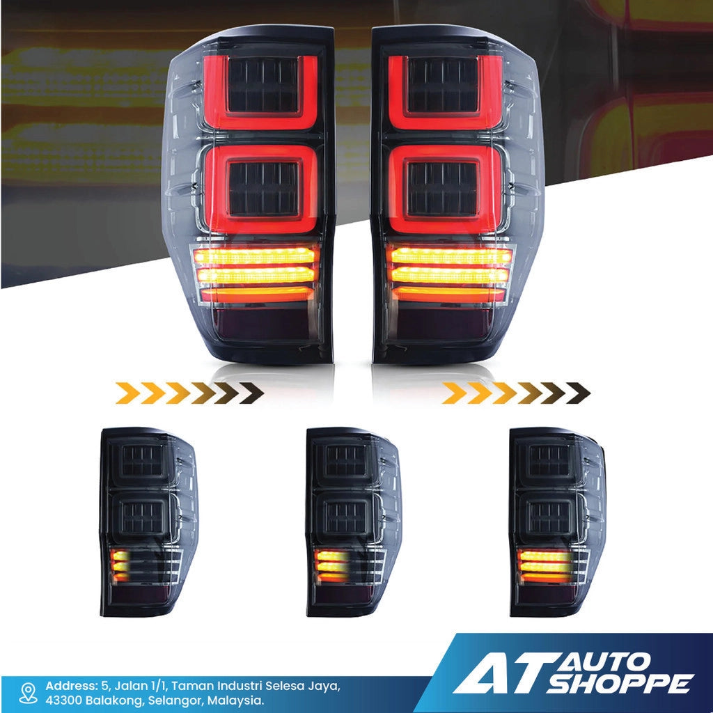 Vland car tail lights with illuminated indicators on a reflective surface, featuring the AT Auto Shoppe logo.