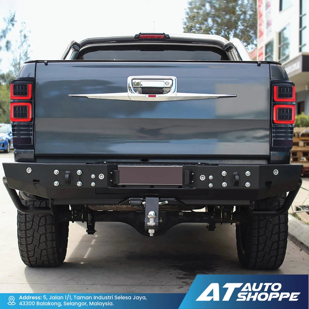 Back view of a black pickup truck with visible branding AT Auto Shoppe