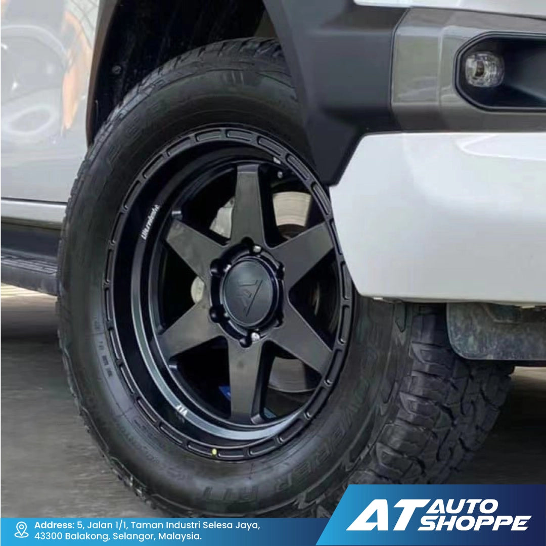 Close-up of a VLF black alloy wheel on a vehicle with AT Auto Shoppe branding.