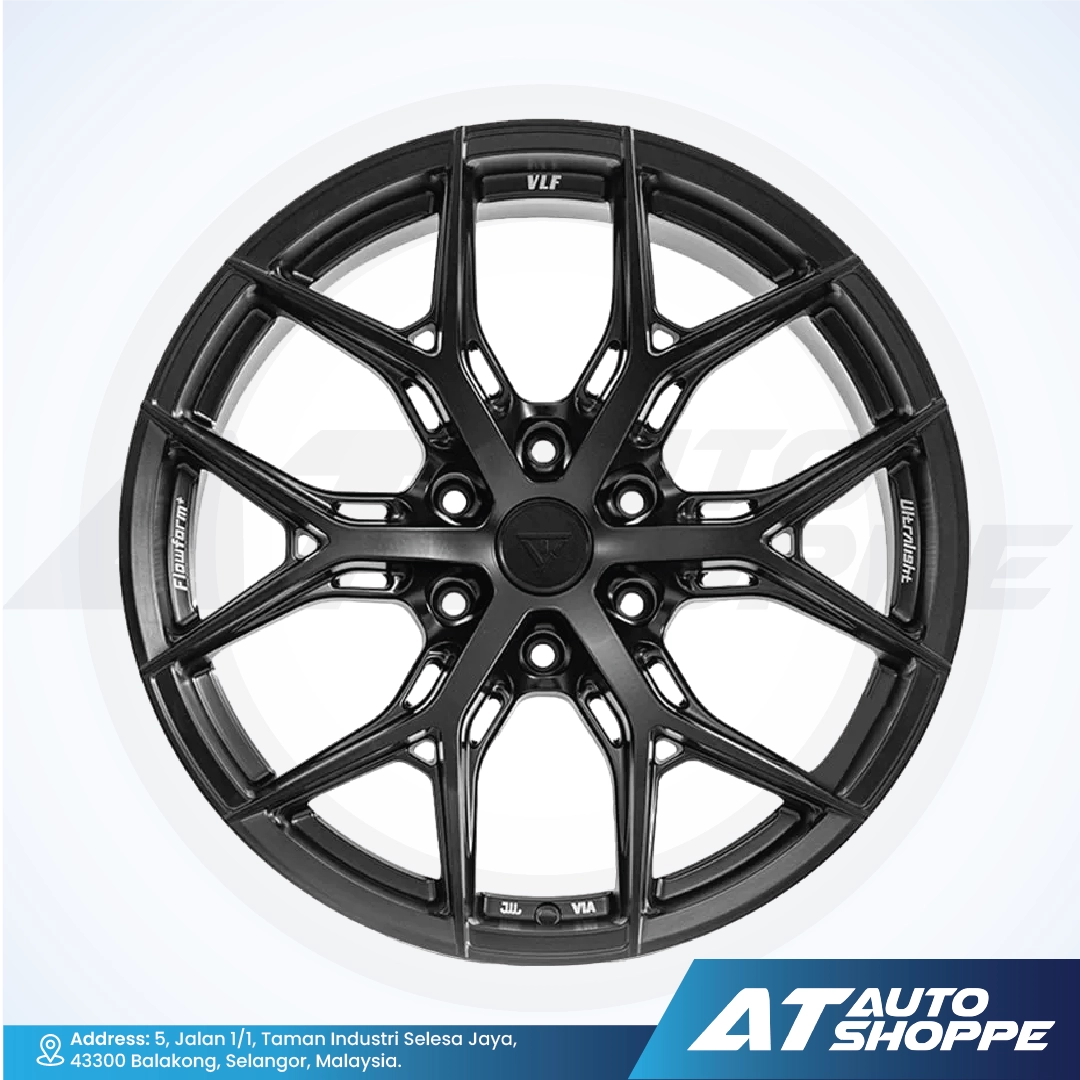 Black alloy wheel with VLF branding on a white background, featuring 'AT Auto Shoppe' logo.