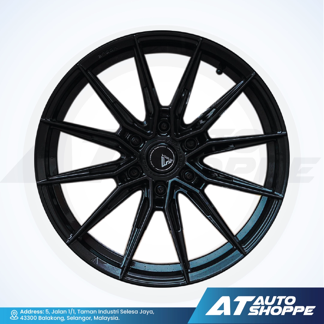 Vogue black alloy wheel on a white background with AT Auto Shoppe branding.