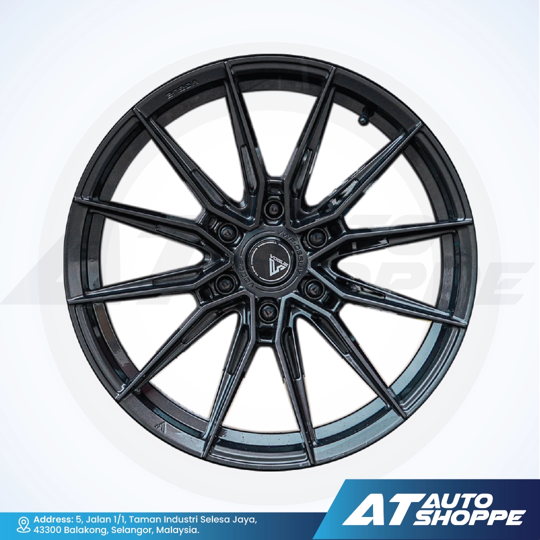 Vogue black alloy wheel on a white background with AT Auto Shoppe branding.
