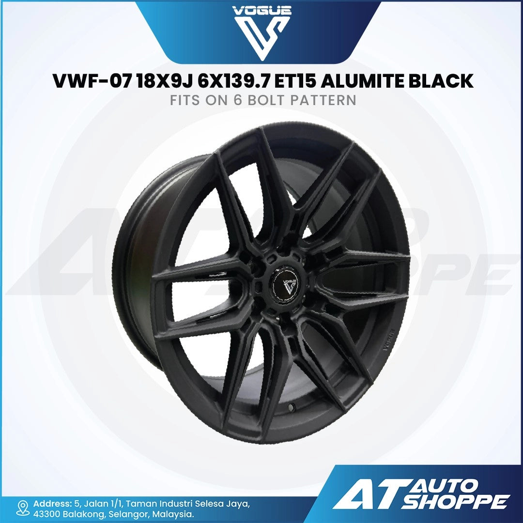 Black alloy wheel with specifications on a white background, featuring the Vogue logo and AT Auto Shoppe branding.