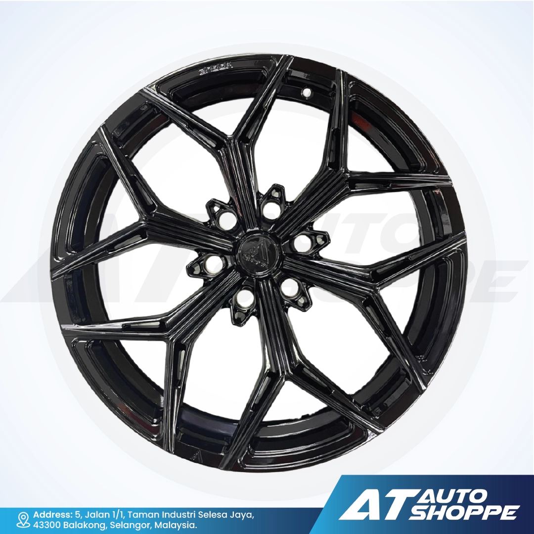 Vogue black alloy wheel on a white background with AT Auto Shoppe branding.