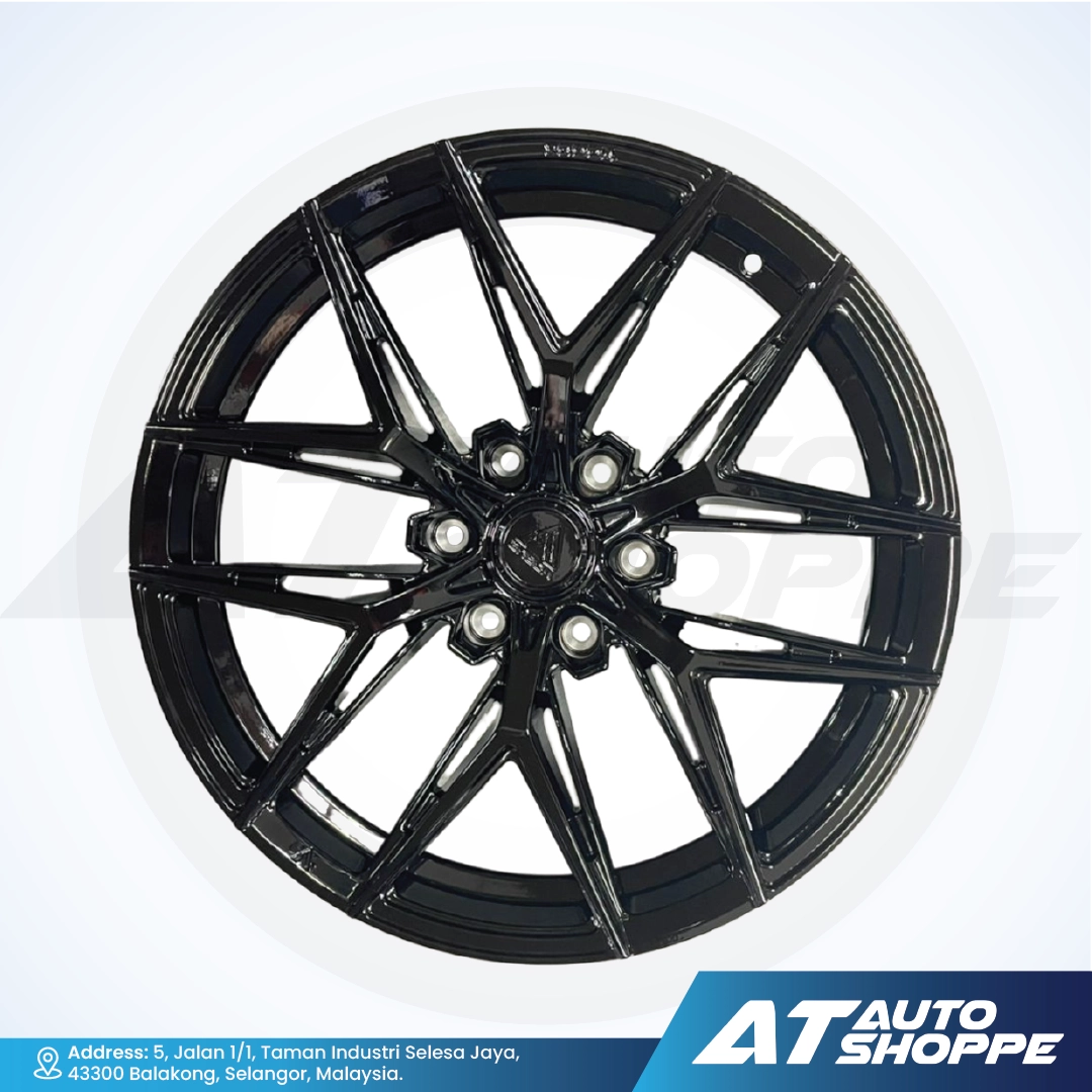Vogue black alloy wheel on a white background with AT Auto Shoppe branding.