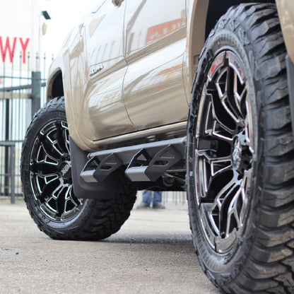 Close-up of a truck's XD wheel and tire with a blurred background