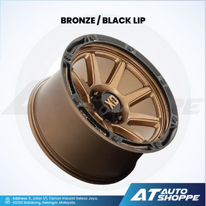 XD bronze alloy wheel with black lip on a white background, featuring AT Auto Shoppe branding.